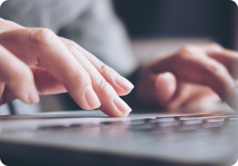 Fingers typing on keyboard